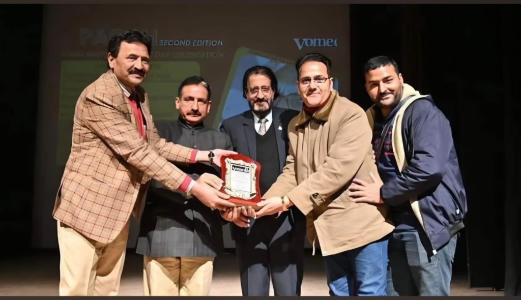 Receiving award at World Mother Language Day celebration